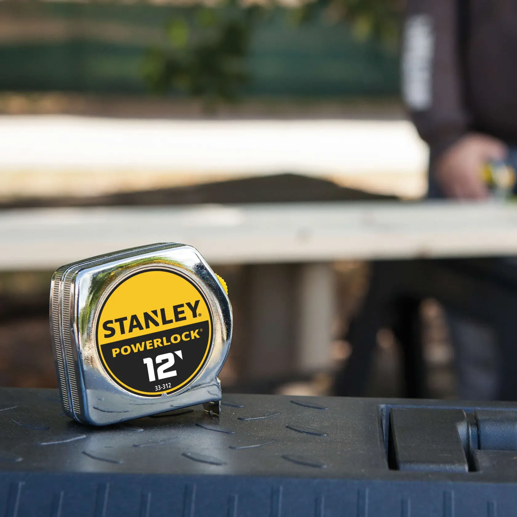 Photo of Stanley PowerLock 12' tape measure 33-312 on a tool box outdoors.