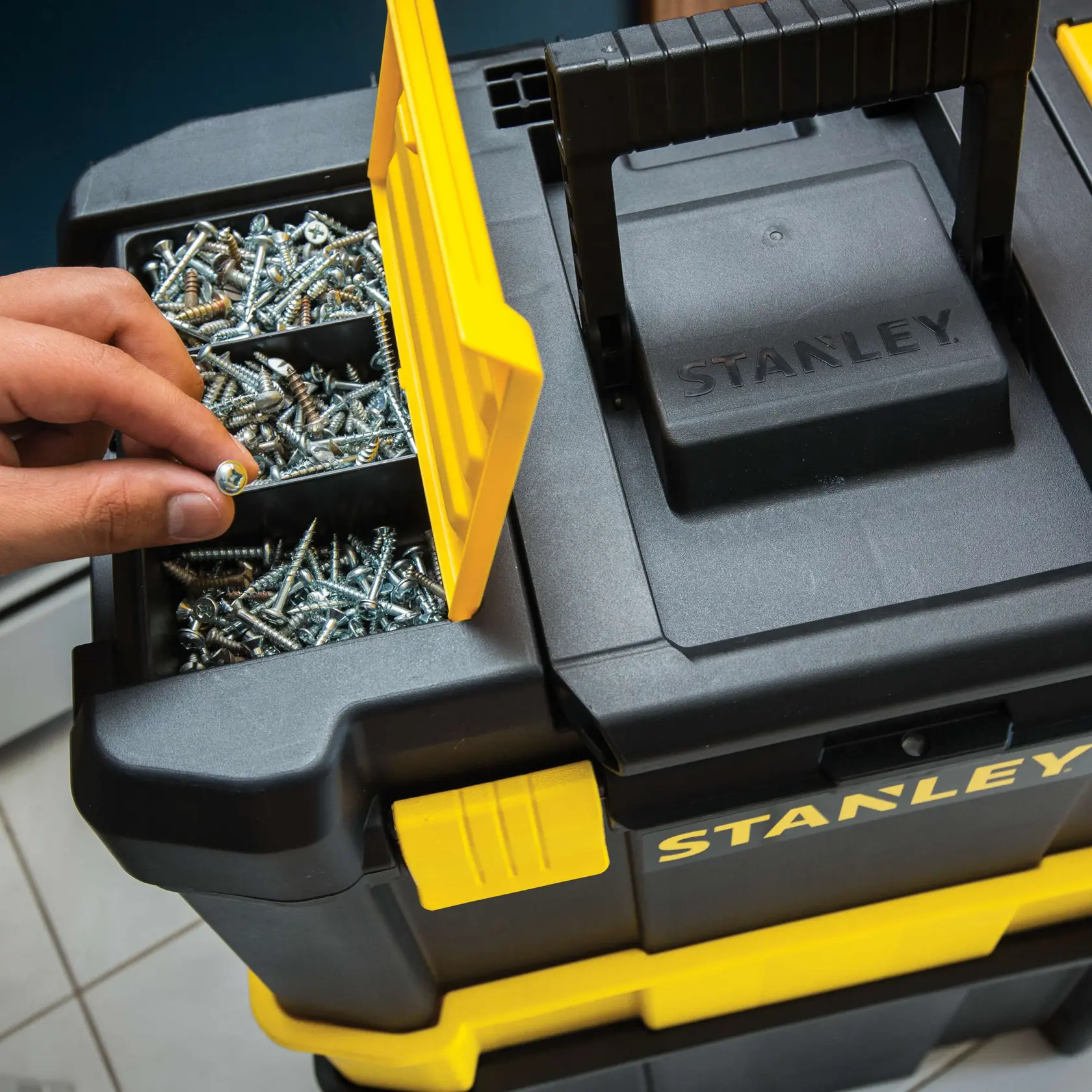 STANLEY STST18631 black and yellow toolbox photography, top view with open compartment holding screws.